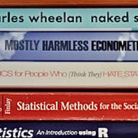 Stack of quantitative social science textbooks