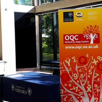 OQC event reception with banner, manor road building entrance hall 